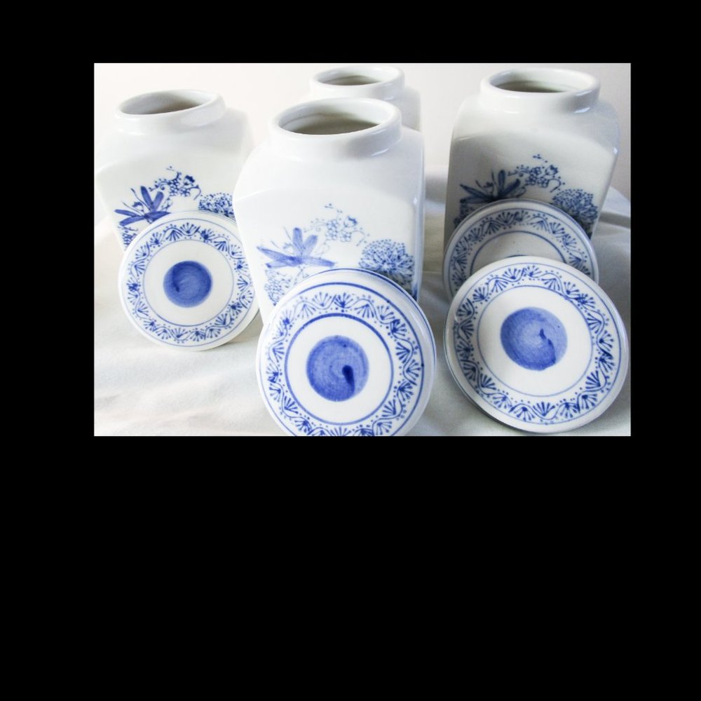 Four Porcelain Vintage Storage Jars